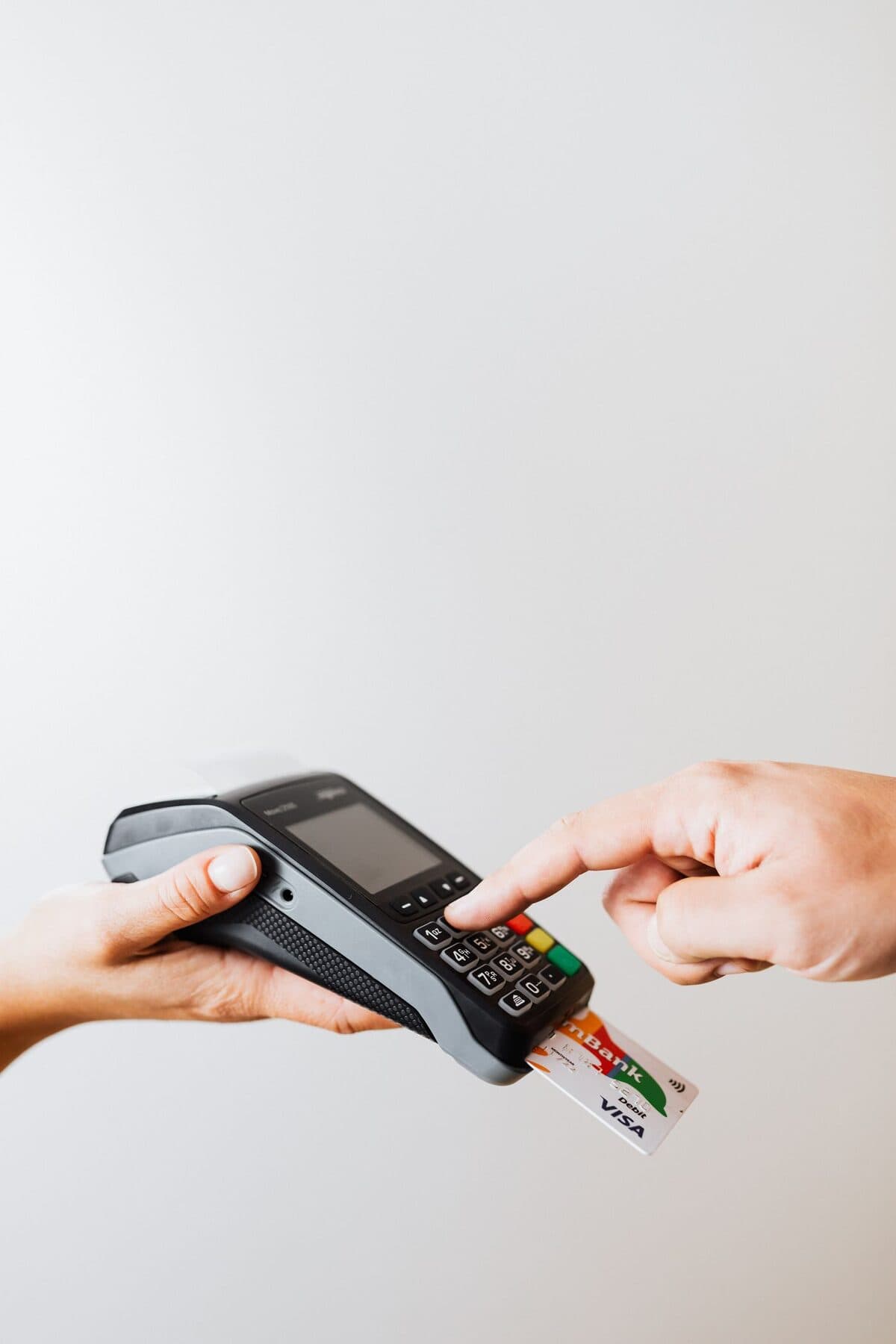 A card being inserted into a payment terminal